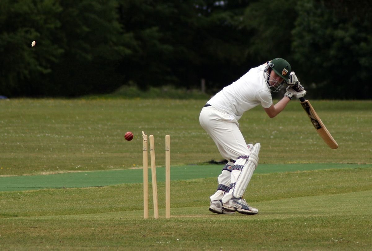 A batter bowled, with the ball passing the stumps
